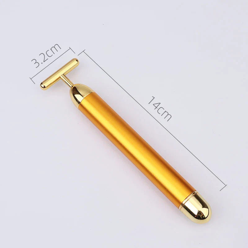 Masajeador facial vibratorio con rodillo dorado